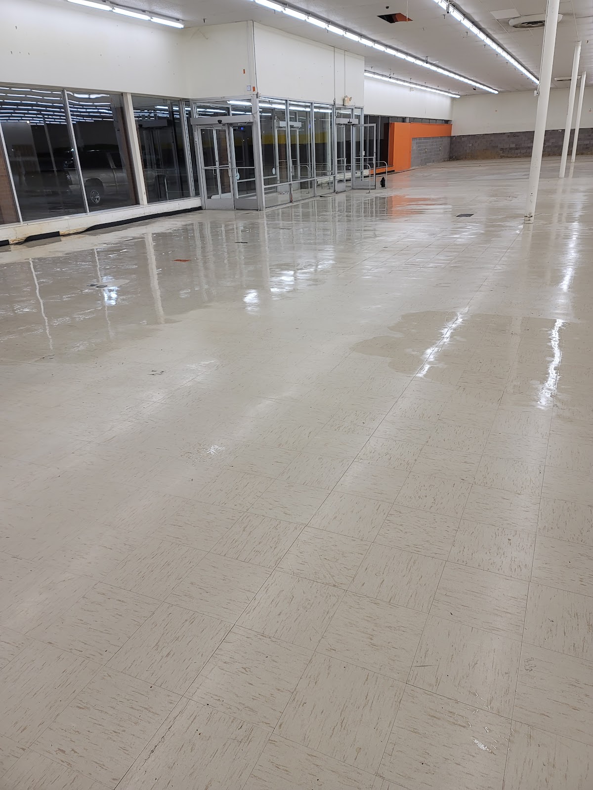 Cleaned commercial floor in a large interior workspace