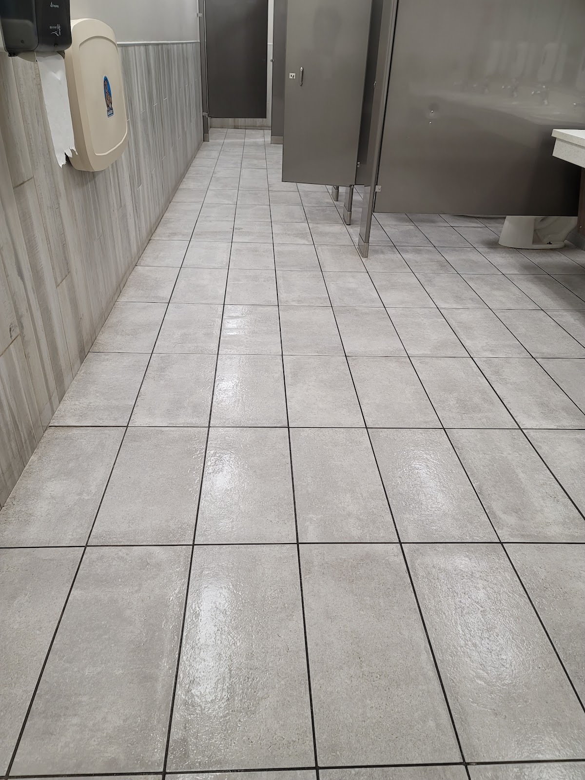Tiled restroom floor in a commercial facility